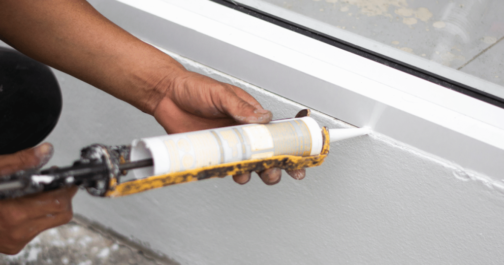 Cracked caulk around a bathroom fixture in a Pittsburgh home