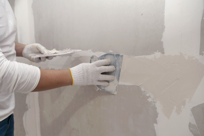 handyman repairing drywall