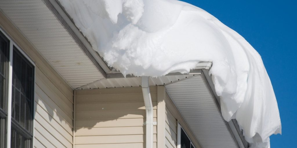Exterior trim and siding on a Pittsburgh home after heavy snowfall