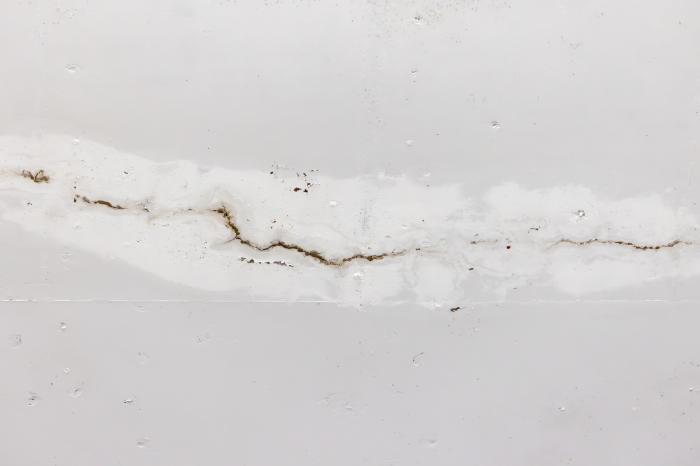 Soft drywall damaged by moisture that needs patching and repair