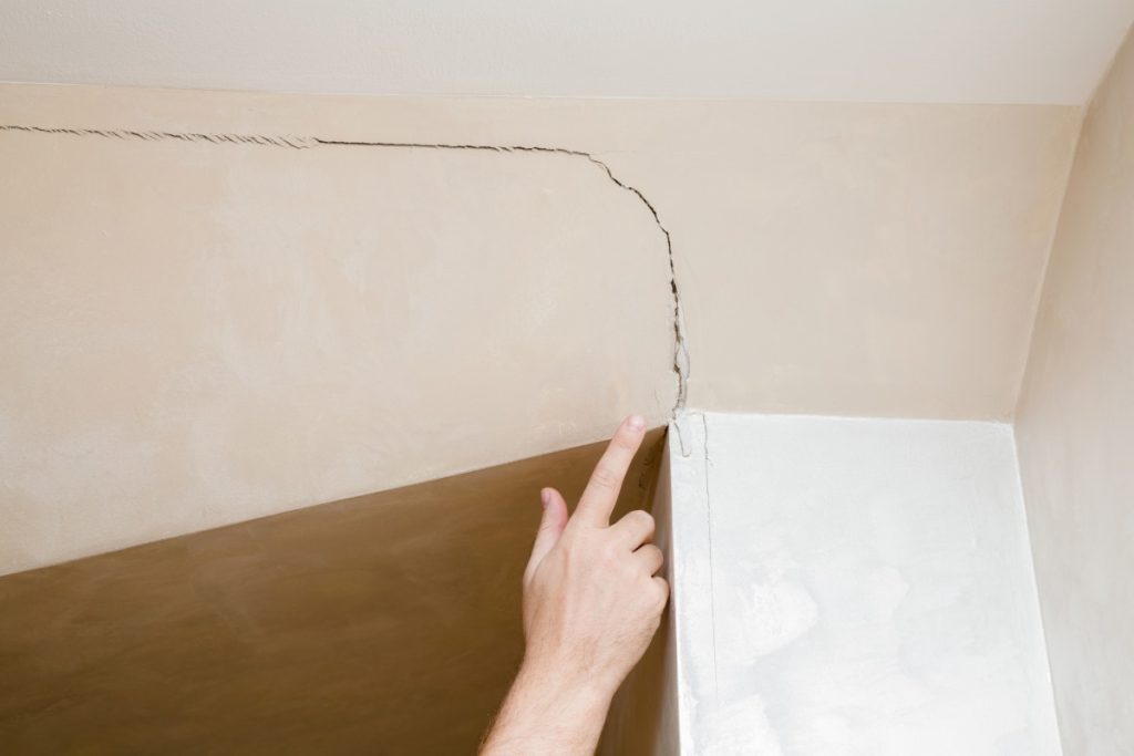 Hairline drywall crack along a seam in a Pittsburgh home during winter
