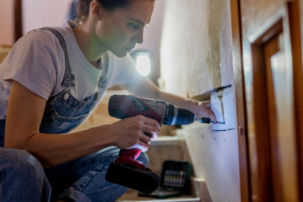Homeowner observing interior walls and fixtures during winter in Pittsburgh