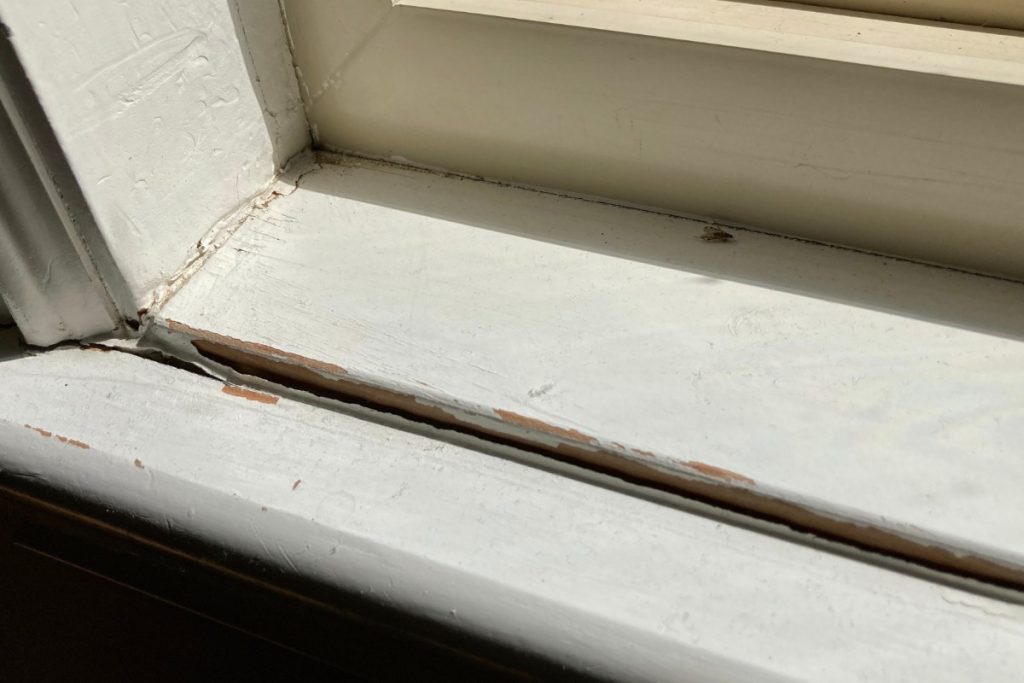 Loose stair railing inside a Pittsburgh home during winter