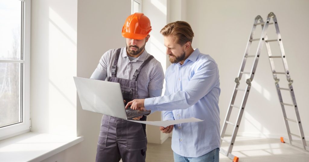 Handyman discussing repair options with a homeowner in Pittsburgh
