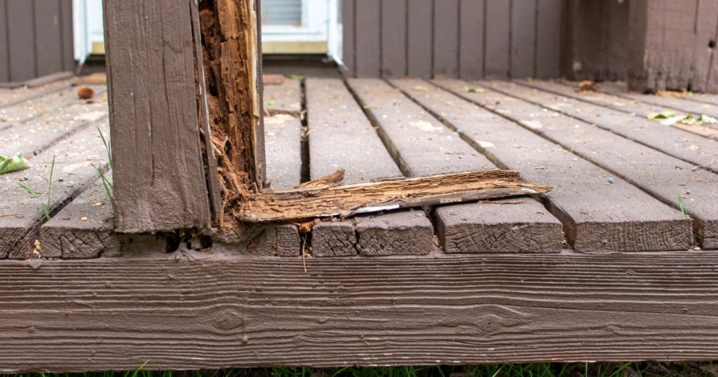 Deck support post and stairs with visible damage