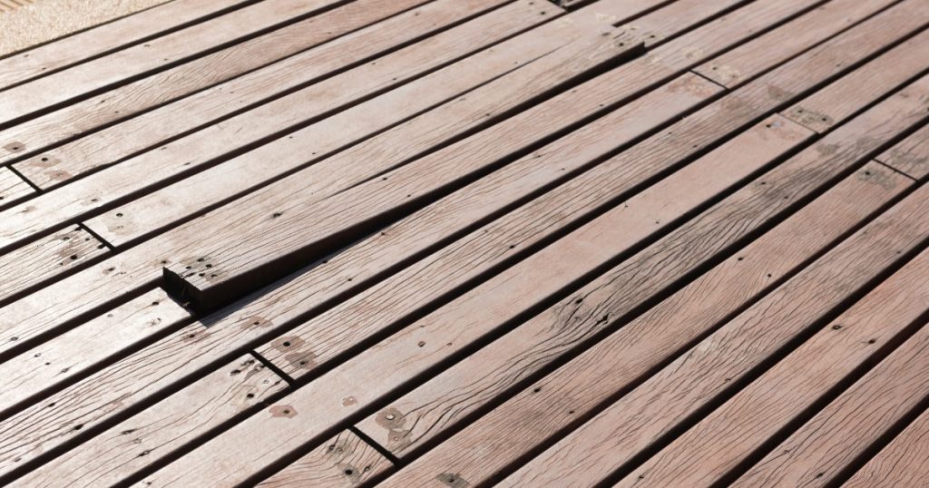 Deck board with raised nail after freeze-thaw cycle in Pittsburgh