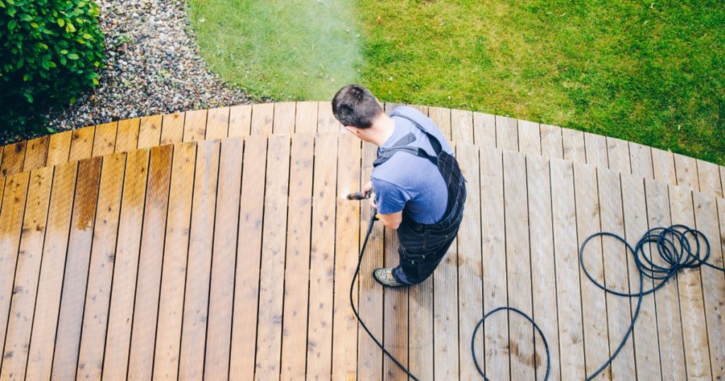 Professional handyman inspecting a deck in Pittsburgh