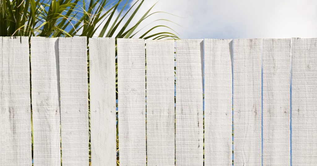 Fence panel with a slightly warped or loose board