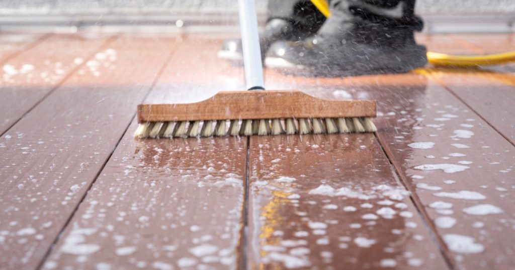 Backyard deck being cleaned