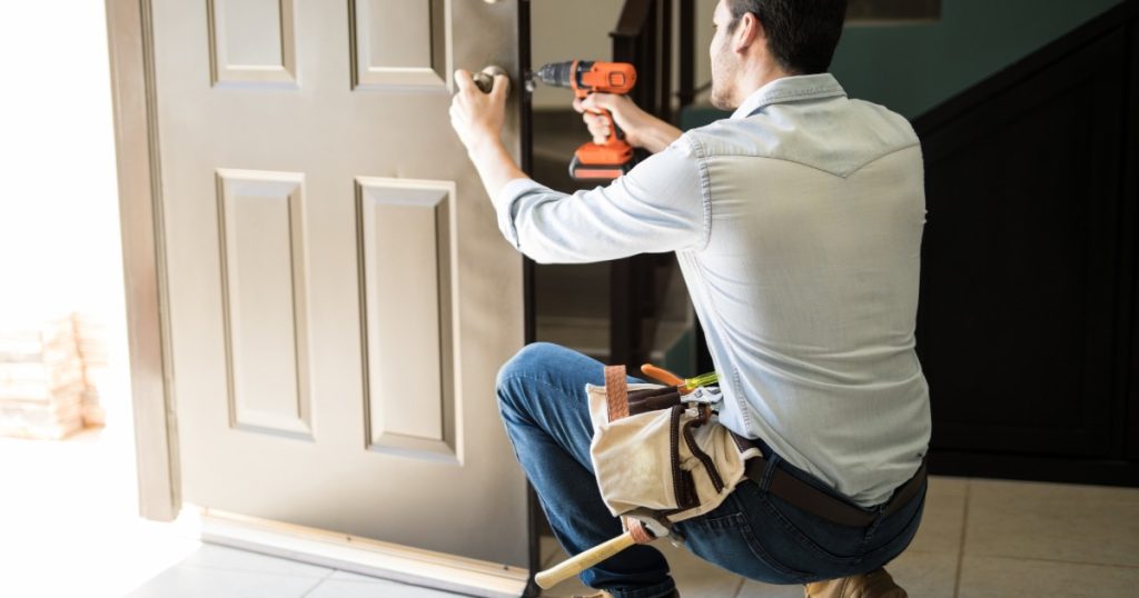Handyman making small exterior repairs on a Pittsburgh home