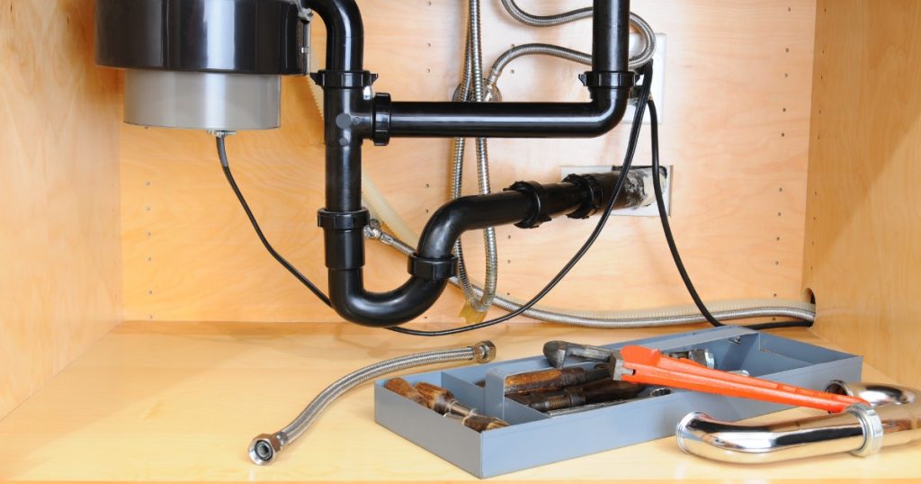 Garbage disposal under kitchen sink — when to repair or replace