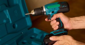 cordless drill being used for exterior projects in pittsburgh