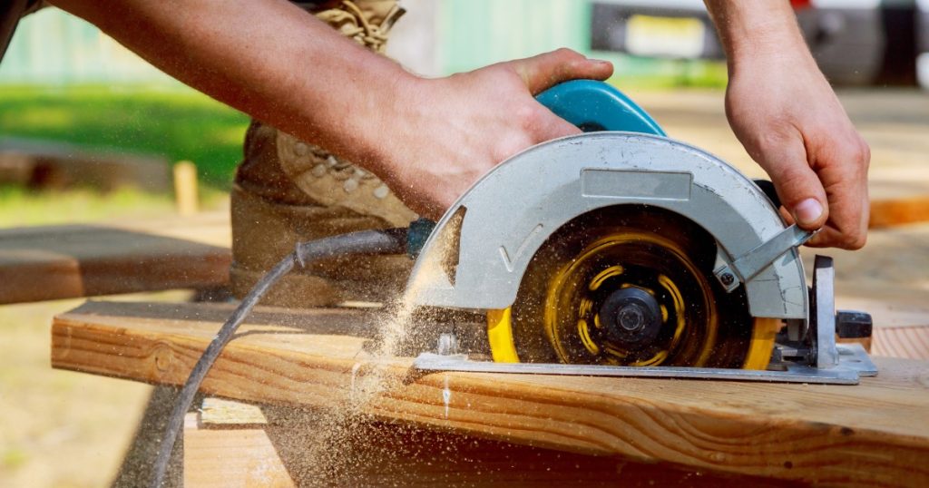 circular saw being used on wood for summer exterior projects