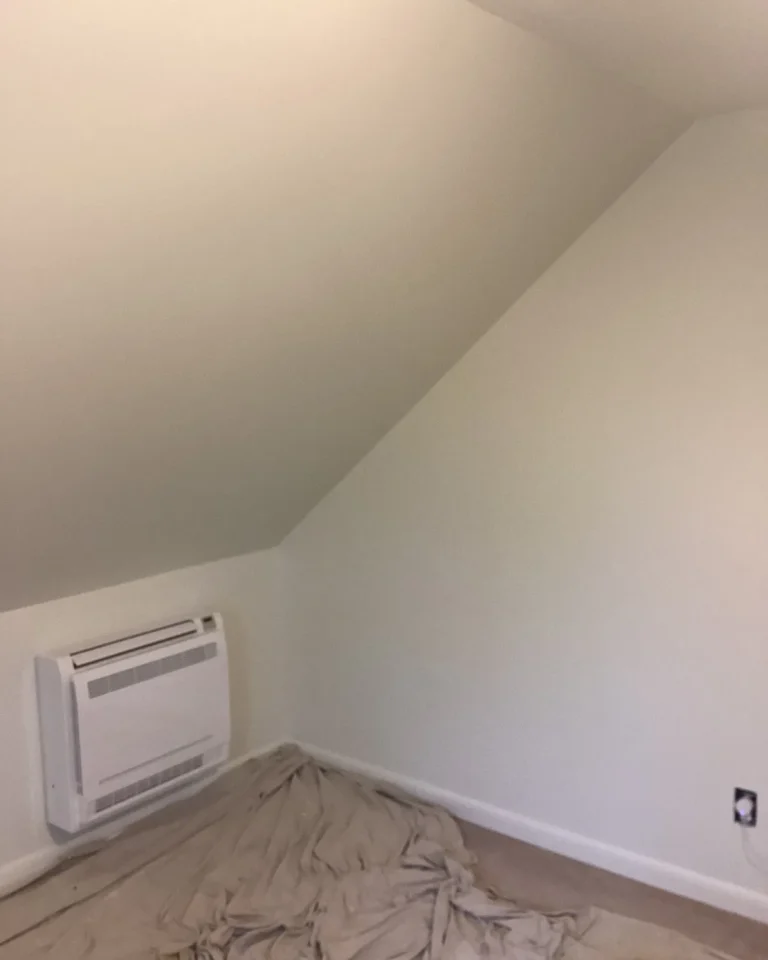 Freshly finished wall above a baseboard heater