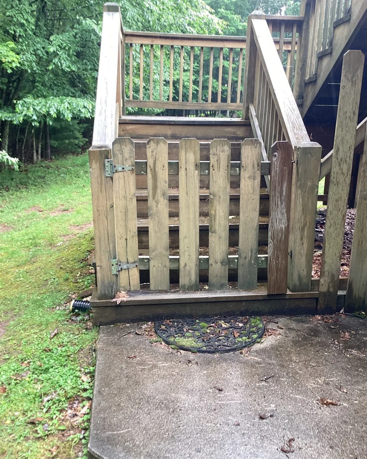 Weathered outdoor stairs and deck before repairs