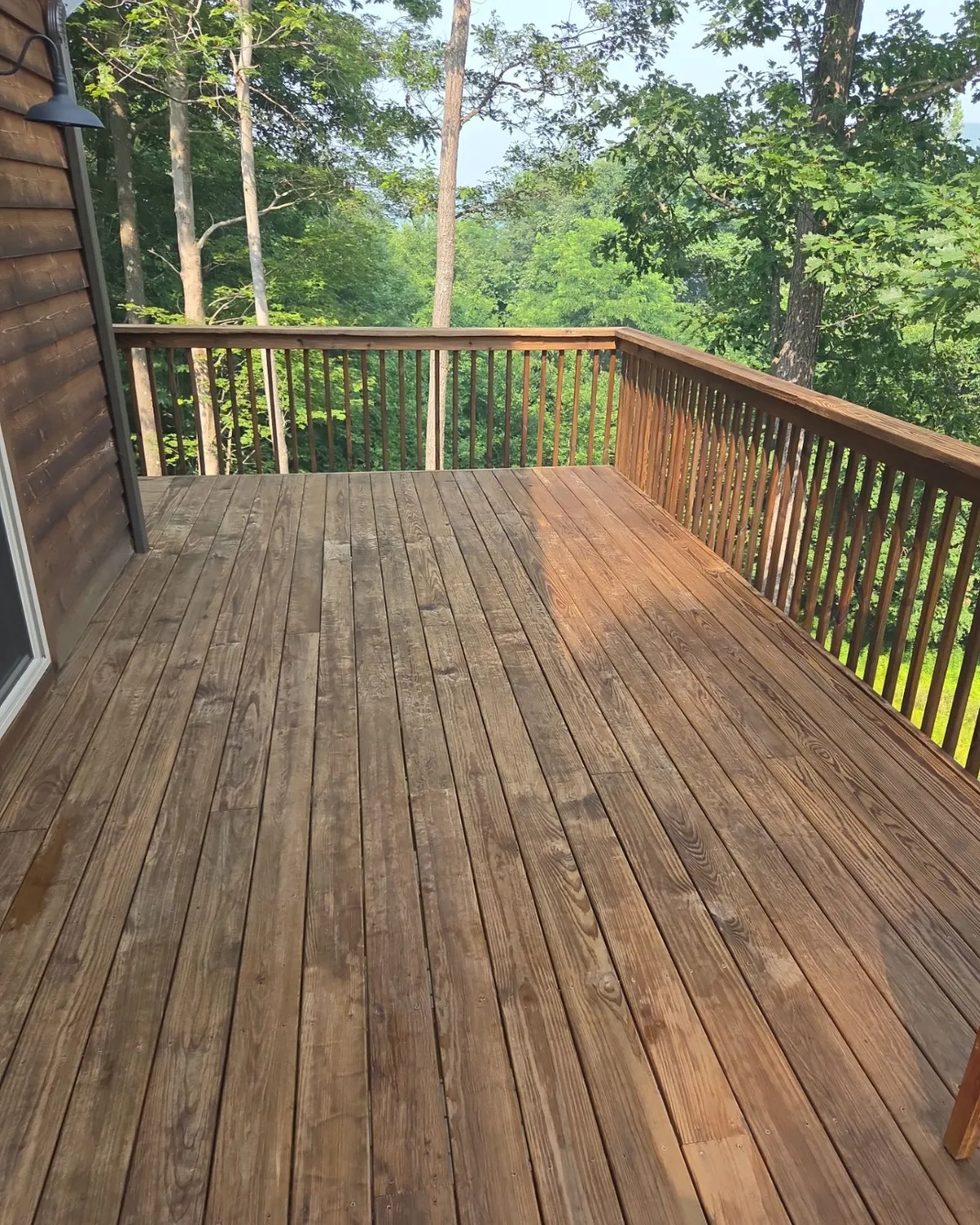 Repaired wooden deck with refreshed boards and railings
