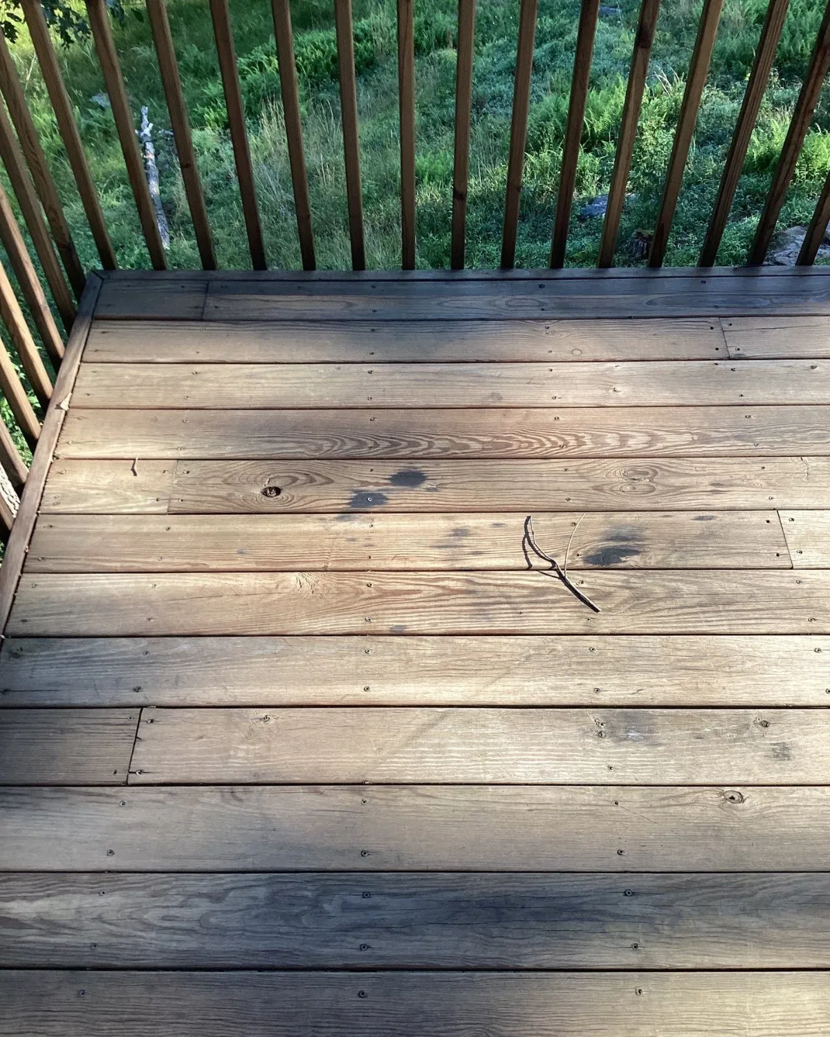 Weathered wooden deck steps before repair