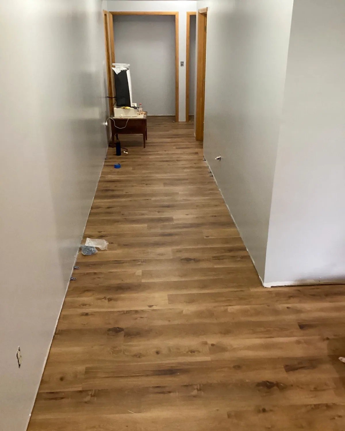 Hallway with newly installed wood-look flooring