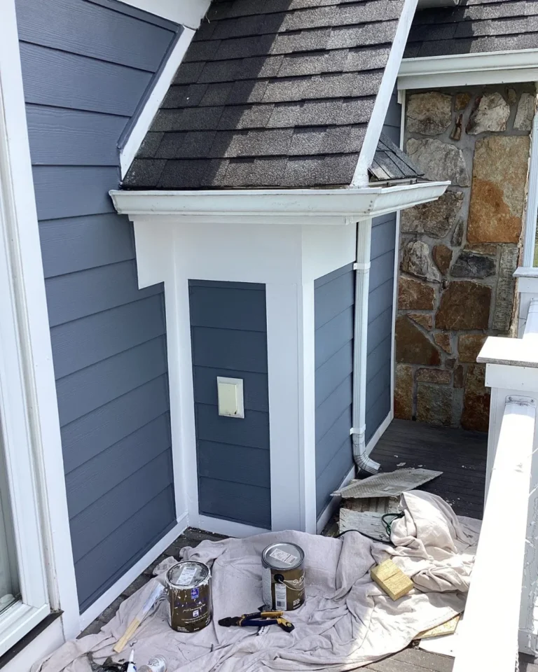 Exterior wall repaired with fresh siding and trim repairs