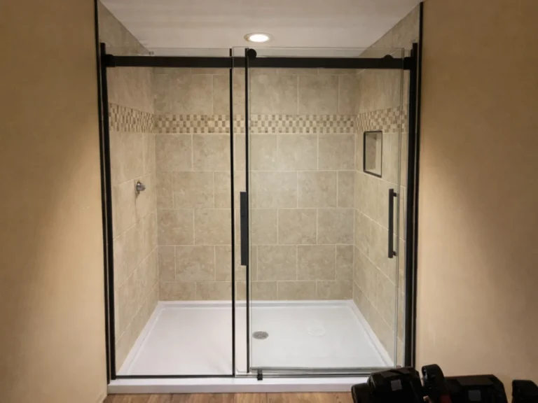 Completed glass shower enclosure with light tile