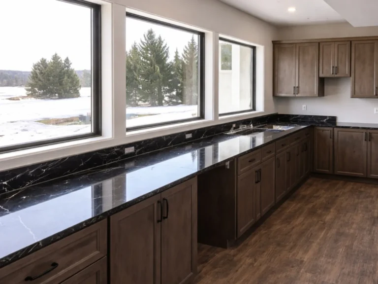 Kitchen cabinets removed beneath a row of windows