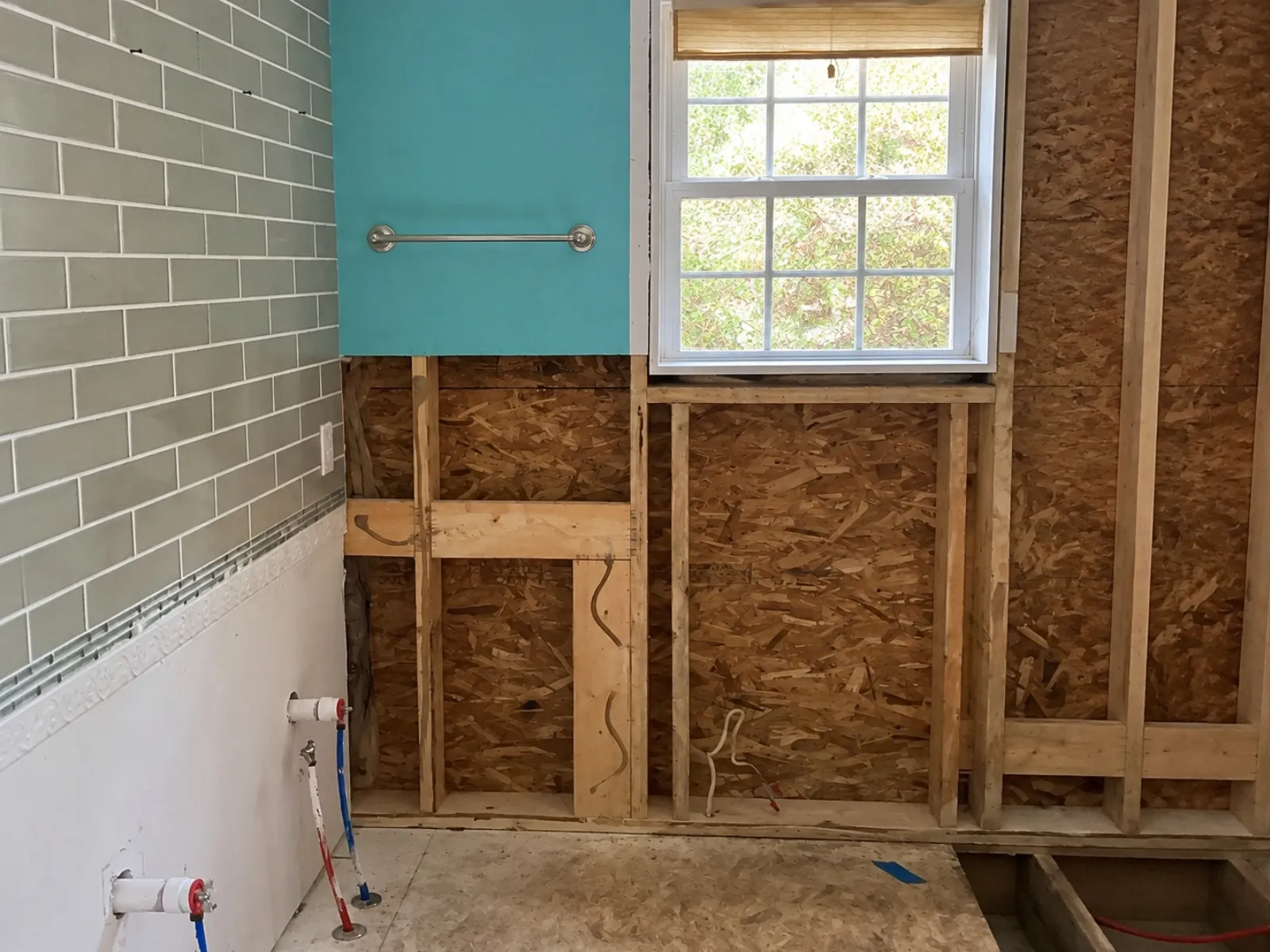 Bathroom wall opened to the studs during renovation