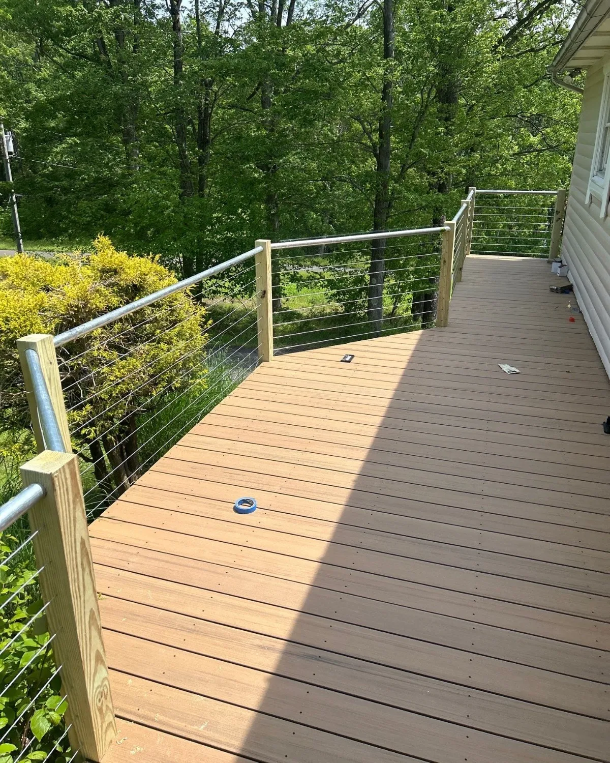 Completed composite deck with dark railings