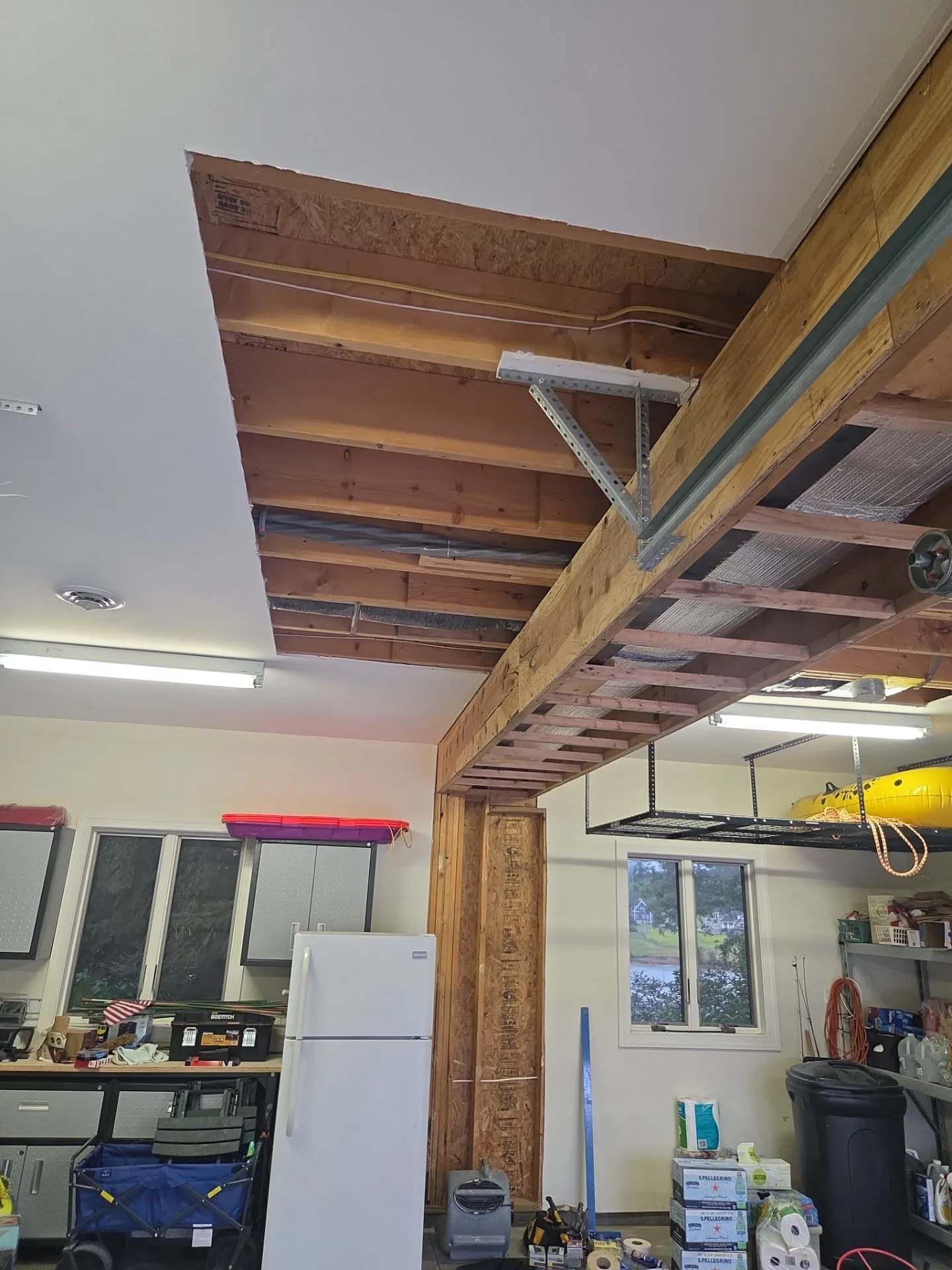 A garage ceiling in need of repair and painting