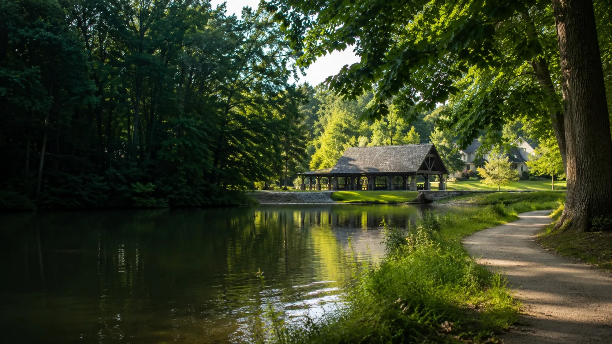 Wooded lakeside trail and park pavilion in McCandless
